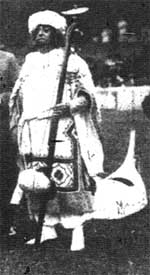 dressed in a bizarre Indian outfit, chirgwin played the bombass at the Music-Hall sports in 1909